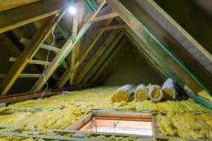 attic insulation being installed