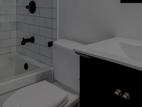 a white and black bathroom with a modern vanity, white toilet, shower with a glass wall and a tub, and black fixtures